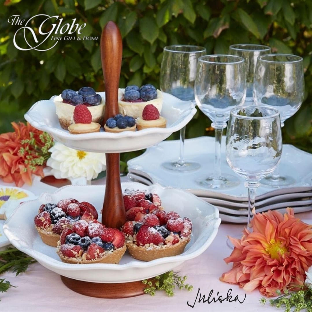 Juliska Berry Thread Whitewash Tiered Serving Stand with treats on a table outdoors.